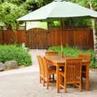 Subject: A garden and patio with outdoor furniture in the warm afternoon sun