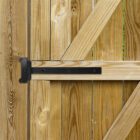 Newly built residential backyard wooden gate with hinges. Vertical.