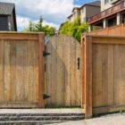 House backyard new wood fence garden gate door in suburban residential neighborhood