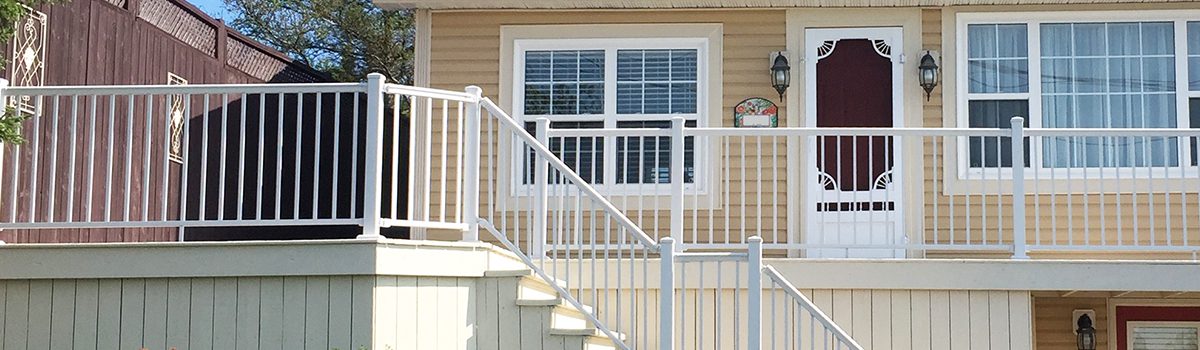 A white metal deck railing.
