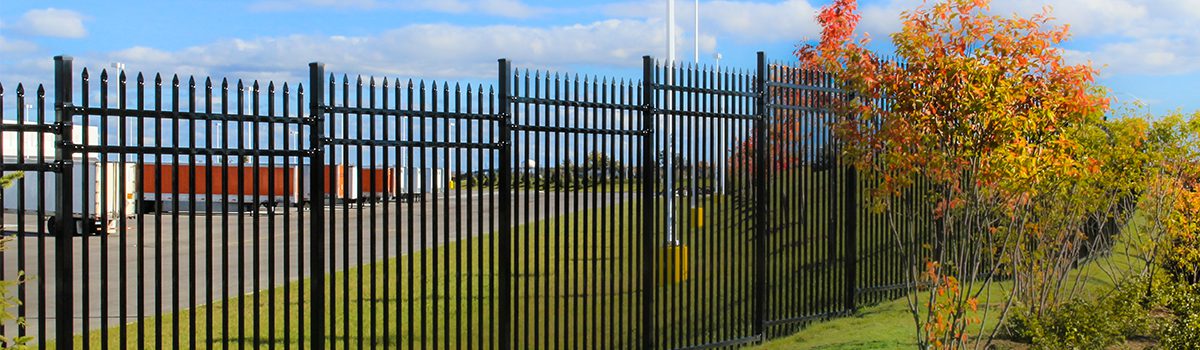A black metal industrial fence.