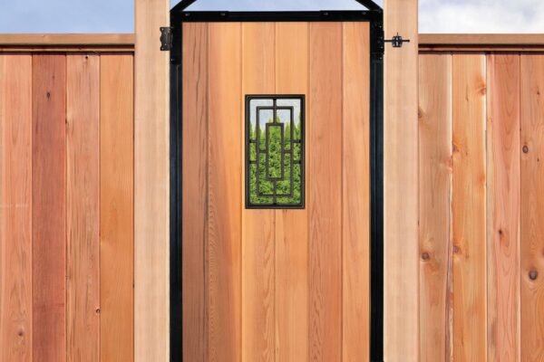 Close-up of a Pro Gate Frame gate with cedar infill and a decorative black metal window insert