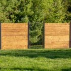 Traxx Horizontal Fence Building System with 9-foot tall post designed for in-ground installation. Ideal for creating modern, sturdy fences.