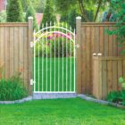 nuvo-iron-extra-wide-white-spear-top-gate-installed-in-wood-fence